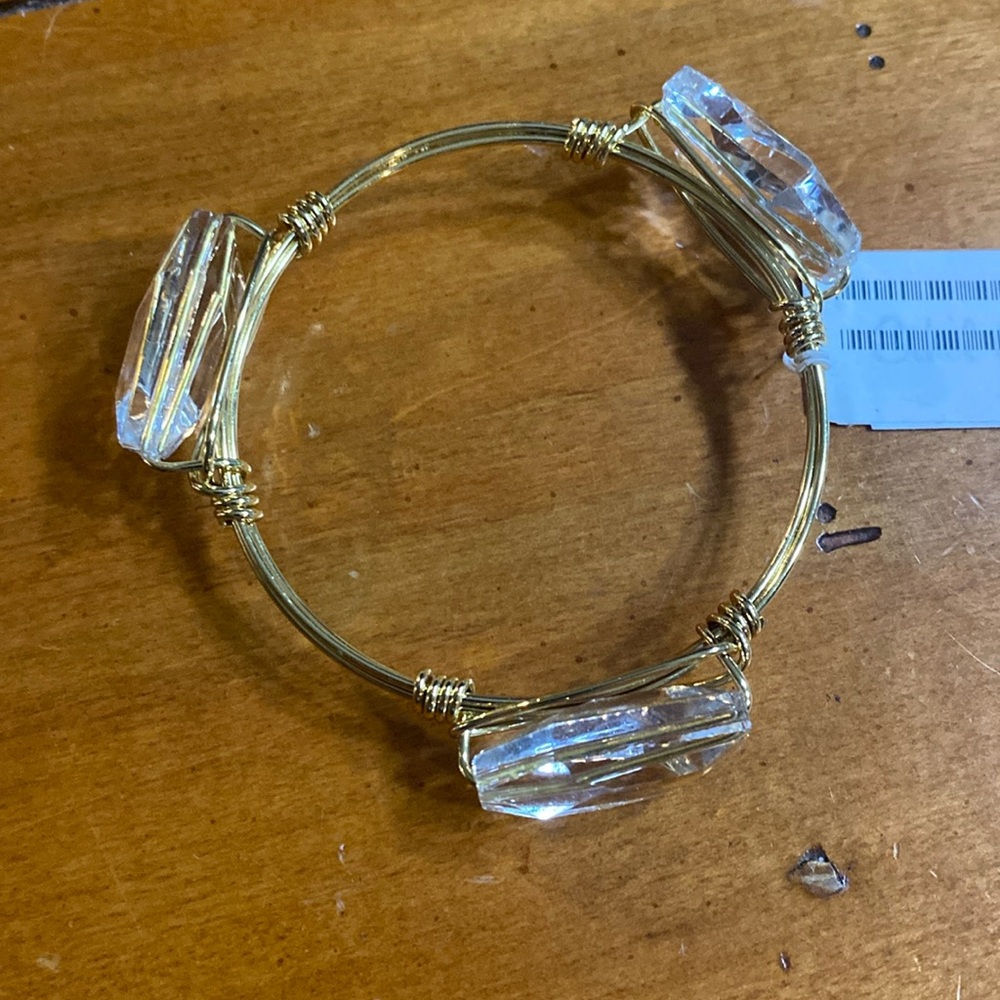 Costume jewelry gold bracelet with 3 crystals. 2.75” wide. NWT